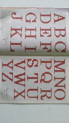 two cross stitch alphabets on top of each other with the letters in red and white