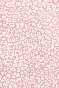 a pink and white animal print rug