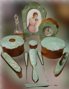 an assortment of green and brown dishes with pictures on the plates, spoons, forks and utensils