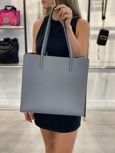 Double top handles, 10" 12.5"W x 13.25"H x 5"D Open top Silvertone hardware One inside zip pocket Leather lining with polyurethane coating Leather Imported Boutique Brands, Style Gift, Open Top, Global Fashion, Marc Jacobs, Top Handle, Color Blocking, Zip Pockets, Silver Tone