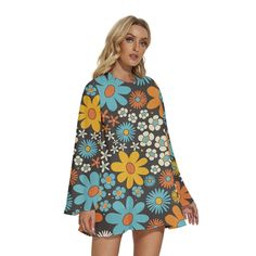 *  Embrace the timeless allure of the 70s with our Bell Sleeve Dress, echoing the iconic 70s Dress Style. * This Hippie Dress exudes vintage charm with its Blue Floral pattern, capturing the essence of Retro fashion. * Crafted from 100% polyester, this Chiffon Tent Dress ensures lightweight comfort and durability. *  Adorned with a vibrant multicolor floral pattern in orange, yellow, and blue, this dress makes a bold statement. * The semi-sheer chiffon material adds an ethereal touch, while the dress is fully lined for modesty and comfort. * Complete with bell sleeves and a keyhole behind neckline with button enclosure, this slip-on Dress offers both style and ease. Designed in California by Trendy Hip Buys. Handmade to order from Overseas Made from 100% Polyester Soft and lightweight chif 70s Dress Style, Bohemian Multicolor Bell Sleeve Dress, Groovy Multicolor Dress With Retro Print, Multicolor Groovy Dress With Retro Print, Multicolor Bell Sleeve Spring Dress, 70s Fashion Dresses, 1970s Retro Print Long Sleeve Dress, Blue Floral Dress, Hippie Dress