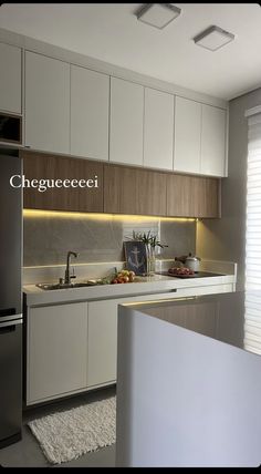 a modern kitchen with white cabinets and stainless steel appliances is featured in the magazine chicago