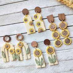 the sunflower earrings are made out of wood and have wooden discs attached to them