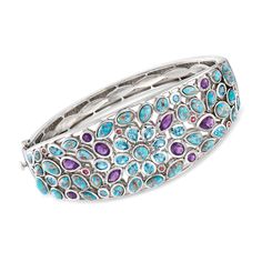 Ross-Simons - 4.80ct t. w. Multi-Gemstone, Turquoise Bangle Bracelet. 8". This cool-toned bangle bracelet will add an artistic flair to your favorite outfits. An eye-catching palette of multi-shaped turquoise cabochons, Swiss blue topaz, amethysts and rhodolite garnets, totaling 4.80 carats, is set in sterling silver. Hinged. Push-button clasp, multi-gemstone and turquoise bangle bracelet. Blue Topaz birthstones are the perfect gift for December birthdays. Elegant Turquoise Multi-stone Bracelets, Blue Multi-stone Bangle, Blue Multi-stone Bangle Jewelry, Fine Jewelry Turquoise Gemstone Bracelet, Turquoise Bangle, Topaz Birthstone, Bracelet In Silver, Stone Bangle, Bracelet Blue