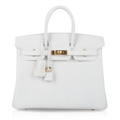 Hermes Birkin HSS 25 bag featured in striking White. This rare clemence Hermes Birkin is divine from the winter slopes to the summer yacht!The most rare leather colour and no longer produced!Accentuated with lush gold hardware.NEW or NEVER Comes with the lock and keys in the clochette, signature Hermes box, sleeper and raincoat. As a purveyor of exceptional and unique Hermes luxury goods, mightychic raises the bar of online shopping.final sale BAG MEASURES:LENGTH 25cm / 9.75" TALL 18.5cm / 7.25"DEEP 13cm / 5.25"HANDLES:TALL 3"CONDITION:NEW or NEVER PLEASE NOTE: Hermes bag payments require bank wire transfer unless arrangements are made prior to purchase Will be delivered with Box, dust bag, card, booklet and receipt Exchange Accepted in this cases :/p> Summer Yacht, Hermes Birkin 25, Hermes Box, Birkin 25, Luxury Goods, Hermes Bag, Hermes Birkin, White Bag, High Quality Leather