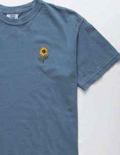 a blue t - shirt with a sunflower embroidered on the front and back pocket