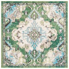 a green and blue rug with an ornate design