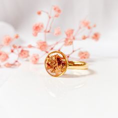 Handcrafted ring with real fall leaves and leaf gold in resin. DETAILS ------------ You get a ring with real dried forest leaves and leaf gold, preserved in crystal clear resin. The ring is ajustable and out of stainless steel. All materials are skin-friendly and suitable for allergy sufferers. These are natural flowers, therefore the shape, size and color of your flower may vary slightly. I press all flowers myself and by hand and will do my best to use only flowers that look as similar as poss Gold Rings With Pressed Flowers For Wedding, Handmade Rose Gold Rings For Gifts, Gold Ring With Pressed Flowers, Handmade Gold Rings As Gift For Her, Minimalist Gold Rings As A Gift For Her, Gold Promise Rings With Natural Inclusions, Forest Ring, Flower Fall, Forest Leaves