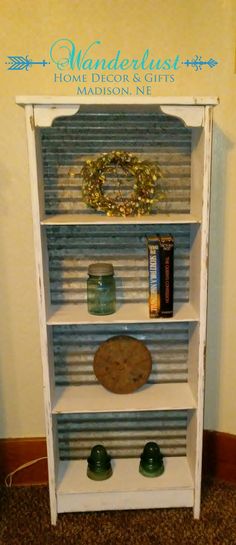 a white book shelf with books and other items on it