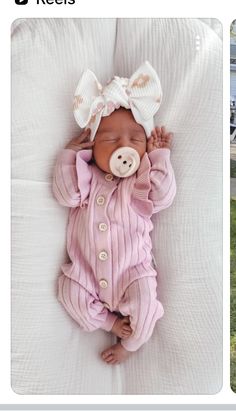 the baby is wearing a pink outfit