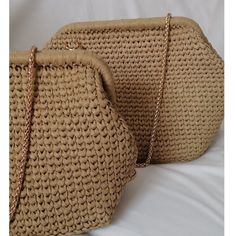 This raffia bag is small size.(20cm - 7.87'') 100% hand-knitted messenger bag with raffia drawstring made of eco-friendly organic yarn. It completes your combinations with its unique appearance. It is a great gift option with its two different uses as both a handbag and a shoulder bag. The reason why they look steeper and shapeless is that they are knitted with two layers of raffia yarn.  Features:  * On-off with hidden metal clip  * Both handbag and shoulder bag  * Gold color chain hanger  * Cotton lining  * Small 20 cm-7.87 inc , large 25 cm-9.84inc metal clips were used.  Cleaning:  Do not wash.  Clean only with a wet cloth or wet wipe.  Not:  All bags are 100% handmade, meaning there may be small parts in design, size, color and fastening. Product color, length slightly depends on phot Natural Straw Pouch Bag With Detachable Handle, Natural Pouch Straw Bag With Detachable Handle, Natural Pouch Bag With Detachable Handle, Natural Color Pouch Bag With Detachable Handle, Natural Clutch Shoulder Bag With Detachable Handle, Natural Shoulder Bag Clutch With Detachable Handle, Beige Clutch Shoulder Bag With Braided Handles, Daily Use Clutch With Braided Handles, Beige Shoulder Clutch Bag With Braided Handles