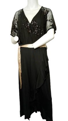 Add a touch of glamour to your wardrobe with this black sheer women's dress from Nextmia. Featuring shimmering sequins and a stylish sash, it's perfect for special occasions or night out. Special Features: 100% Polyester Comfort: Enjoy all-day comfort and breathability with this lightweight dress. Black Color: A classic and versatile color that complements various outfits. Sheer Design: The sheer fabric adds a touch of playfulness and texture. Sequin Detailing: The sequins create a dazzling and Summer Evening Dresses With Sashes, Black Tie Waist Evening Dress, Black Belted Party Dress, Elegant Evening Dress With Sashes, Elegant Black Sequin Dress With Contrast Sequin, Glamorous Belted Dress For Formal Occasion, Glamorous Belted Formal Dresses, Elegant Party Dress With Tie Waist, Glamorous Formal Belted Dress