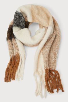 The Lulus Cozy Addition Brown Multi Marled Plaid Fringe Oversized Scarf is an essential accessory for staying stylish and warm this winter season! This ultra-soft fuzzy marled knit scarf features a brown, black, and white plaid pattern throughout that shapes a wide oversized silhouette with long fringe trim at either end. Fabric: Fabric has no stretch. Scarf Measures 96" Long. 19. 75" Wide. 100% Polyester. Imported. Lulus | Cozy Addition Brown Multi Marled Plaid Fringe Oversized Scarf | 100% Pol Lulu Fashion, Long Fringe, Long Fringes, Oversized Scarf, Black And White Plaid, Fringe Scarf, Brown Plaid, Oversized Silhouette, Fringe Trim