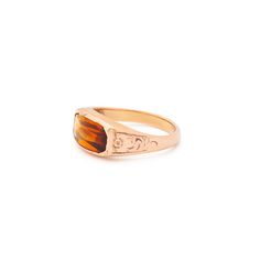 The Story A chic and classic Victorian era ring set with a beautiful citrine sitting front and center. Constructed from 14k rose gold, the long faceted stone measures 12.2 mm by 6.3 mm. Set flush with the setting, the pieces has a sleek, uniform look and feel. The back is open allowing light to pour through, making the stones color pop. Beautiful hand enraged floral detailing finishes the ring perfectly. The simple, yet classic construction is all this ring needs. We love it worn on its own, paired with other pieces, or stacked with your favorite rings. The Specs Style Number: R3536 Victorian, 1890s-1900 14 karat rose gold Citrine measures 12.2 x 6.3 mm Height of front face of ring 0.37", depth of ring as it sits off finger 0.13", width of entire ring 0.76" Band width tapers from 3.7 mm do Elegant Citrine Signet Ring For Formal Occasions, Elegant Formal Citrine Signet Ring, Elegant Faceted Citrine Rings, Elegant Citrine Signet Ring With Gemstone, Elegant Citrine Gemstone Signet Ring, Classic Formal Rings With Faceted Details, Classic Formal Faceted Rings, Classic Rose Gold Topaz Ring For Formal Events, Classic Rose Gold Topaz Ring For Formal Occasions