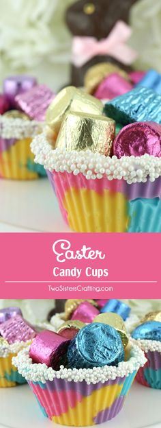 colorful candy cups with chocolate candies in them on a white plate and pink background