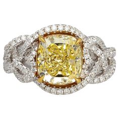 a fancy yellow and white diamond ring