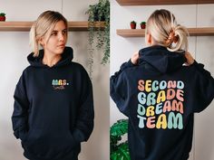 Second Grade Dream Team Hoodie, Personalized Teacher Hoodie, Custom Second Grade Teacher Hoodie, Custom Teacher Name Hoodie, Back To School 💖Youth Hoodies do not have drawcord for added safety!💖 Material: 50% cotton, 50% polyester for a comfortable and durable blend. Fabric: Medium-heavy (8.0 oz/yd² or 271.25 g/m²) for warmth on cooler days. Fit: Loose fit for comfort without sacrificing style. Label: Sewn-in for a seamless feel. Sizing: Check our sizing chart for the right fit. HOW TO PLACE Y School Hoodie Sweatshirt With Drawstring Hood, School Hoodie With Drawstring Hood, Long Sleeve Hoodie With Ribbed Cuffs For School, Black Hooded School Hoodie, Black Hooded Hoodie For School, Hooded Hoodie With Drawstring For School, Hoodie Back, Hoodie Personalized, Second Grade Teacher