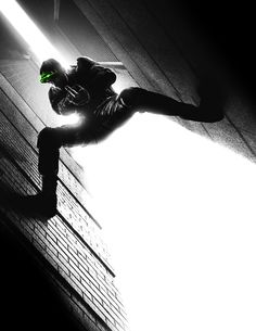 a man riding a skateboard up the side of a brick wall in black and white