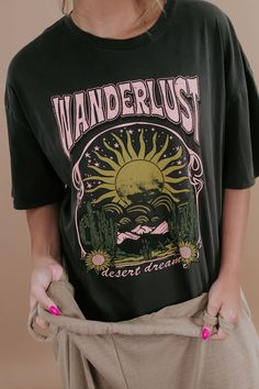 Embark on a style journey with the Wanderlust Sun Graphic Tee in Charcoal. This tee exudes a sense of adventure with its wanderlust-inspired sun graphic, adding a touch of free-spirited charm to your casual look. Graphic Tee Full length Oversized fit Pink/Yellow/Green 100% cotton Imported Model Specs: Emily is wearing a size small in the photo.How will this item fit you? Check out our MODEL SPECS (Typical Sizing - Karli: S-Size 5/26 - 5ft 2in, Emily: S-Size 3/25 - 5ft 5in, Syd: L/XL- Size 15/ - Summer Adventure T-shirt With Text Print, Green Summer Adventure Top, Black Bohemian T-shirt With Letter Print, Trendy Outdoor Relaxed Fit T-shirt, Trendy Relaxed Fit T-shirt For Outdoor, Bohemian Graphic Print T-shirt For Vacation, Trendy Outdoor Graphic Print T-shirt, Relaxed Fit Graphic Print Top For Adventure, Vintage Summer Outdoor T-shirt