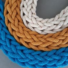 three different colored ropes on top of each other, one white and the other blue