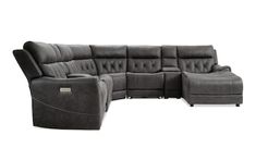 a grey sectional sofa with two recliners