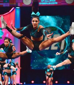 a group of cheerleaders performing on stage