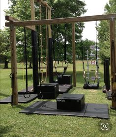 an outdoor gym is set up in the grass