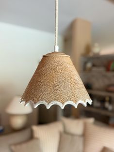 a lamp hanging from a ceiling in a living room