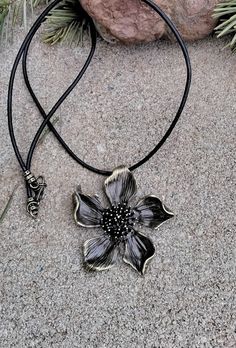 "GH42-I love this piece....Pretty bronze colored zinc alloy metal flower that measures 2\" X 2\".  I have attached a black 1.5mm rolled leather cord with antique bronze findings and bronze lobster clasp measuring approximately 20\" in length.  Nice birthday or mother's day gift." Bronze Necklace, Wood Necklace, Metal Flower, Metal Flowers, Bronze Color, Flower Necklace, Piercing Jewelry, Leather Cord, Necklace Pendant