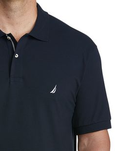 Comfortable, breathable and made to move with you, this classic Nautica polo shirt is crafted in a stretch cotton blend and features an embroidered chest logo, giving it a signature look that's versatile enough to wear everywhere from the office to a night out on the town.96% cotton/4% elastaneFinely ribbed collar2-button placketSignature embroidered chest logoShort sleeves; ribbed-knit cuffsTennistail hemFor additional colors, see G4542 Machine wash; imported 96% cotton/4% elastane Finely ribbe Casual Navy Polo Shirt With Embroidered Logo, Classic Moisture-wicking Polo Shirt, Moisture-wicking Cotton Collared Polo Shirt, Navy Cotton Moisture-wicking Polo Shirt, Pique Polo Shirt, Signature Look, Anniversary Sale, Knit Cuff, Big & Tall