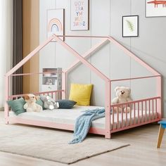 a child's bedroom with a pink bed frame