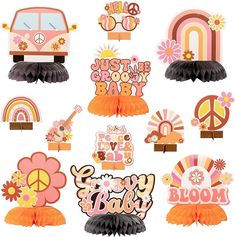 some pink and orange decorations on top of each other in different shapes, sizes and colors