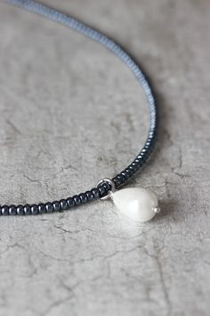 This delicate minimalist necklace was made of black hematite seed beads, white crystal pearl coated drop bead, strong nylon double thread with silver tone clasps, stainless steel adjustable length chain and silver tone lobster clasp. Perfect jewelry for everyday wear! The length of necklace is 40 cm (or about 15.8 inches) and 5 cm of adjustable length chain. Other necklaces you can find in my store in the necklace section. https://www.etsy.com/shop/NaTavelli?section_id=14843046&ref=shopsecti Minimalist Teardrop Drop Necklace With Pearl Charm, Minimalist Beaded Necklace With Pearl Charm As Gift, Minimalist Pearl Teardrop Pendant Necklace, Everyday Minimalist Teardrop Pearl Necklace, Minimalist Beaded Necklace With Pearl Drop As Gift, Minimalist Beaded Necklace With Pearl Drop For Gift, Minimalist Beaded Necklace With Pearl Pendant For Gift, Minimalist Drop Pearl Chain Necklace, Minimalist Necklaces With Pearl Charm