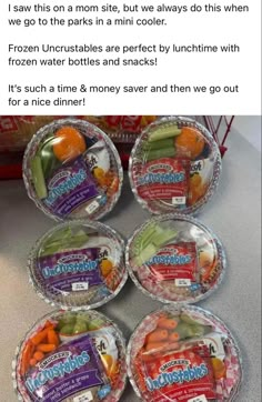 four plastic bowls filled with carrots, celery and other vegetables on top of a counter