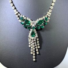 Necklace Rhinestones Green Clear Stunning Vintage In excellent condition. Fantastic necklace perfect for dress up, holidays, etc. Brilliant green and clear rhinestones are on a silver tone setting. Spectacular! Measures approximately 16.5 inches long. Clasp mechanism is in good working order. NECK0024 Sparkling Green Crystal Jewelry, Costume Jewelry Crystal Necklace With Rhinestones, Green Crystal Necklaces With Sparkling Stones, Green Crystal Rhinestone Necklace, Crystal Rhinestone Costume Necklace, Elegant Green Rhinestone Necklace With Sparkling Stones, Green Rhinestone Necklaces For Formal Occasions, Green Crystal Jewelry With Rhinestones, Green Crystal Rhinestone Necklace For Formal Occasions