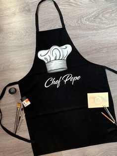 Handpainted Cooking Apron, Personalized Chef Apron, Custom Name Apron, Kitchen Apron, Baking Gift, Housewarming Gift, Master Chef Apron 100% Cotton 100% Love ❤ Hand Painted Cooking Apron by JulieBoutiqueAndArt! Unique Kitchen Apron - hand painted with professional water resistant textile paint for cooking lovers. If you want to make your loved one or yourself happy  with a gift personalized with his name. Just type the name or other caption in the personalization option. The apron can be made in Textile Paint, Baking Gift, Handmade Aprons, Apron Kitchen, Love Hand, Baking Gifts, Gift Housewarming, Master Chef, Chef Apron