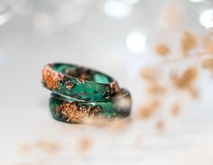 A beautiful faceted dark green resin ring with rose gold metallic flakes inside. This resin ring is perfect for stacking! It's faceted all the way around and it is so comfortable to wear. All my resin rings are handmade with self-made molds. they are also hand-sanded and polished, to be smooth and comfortable to wear. Given the nature of the resin, my rings may contain tiny bubbles and imperfections, but I always try to make them as perfect as possible. MEASUREMENT Width: 6mm/0.24in Thickness: 2 Elegant Green Resin Jewelry, Green Open Ring For Promise, Rose Gold Emerald Rings As Gift, Rose Gold Emerald Ring As A Gift, Handmade Green Promise Ring, Unique Green Jewelry For Promise, Unique Resin Crystal Ring Gift, Handmade Resin Rings As A Gift, Rose Gold Emerald Open Ring Gift