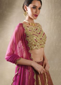 This exquisite Purple Pink Embroidered Banarasi Lehenga Set is crafted from luxurious Banarasi fabric, featuring rich kalidar purple pink lehenga adorned with a striking mirror-embellished belt and border that add a glimmer of sophistication to its traditional weave. Teamed with a classic mirror work blouse, intricately embellished with dori, mirrors, beads, and sequins, exuding an opulent charm. A lightweight tulle dupatta completes the look, delicately sprinkled with mirror buttis and finished Mirror Belt, Brocade Lehenga, Net Blouse, Net Skirt, Mirror Work Blouse, Scallop Border, Rani Pink, Net Blouses, Add Sleeves