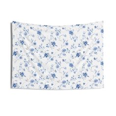 a blue and white floral print pillow case on a white background with an image of flowers