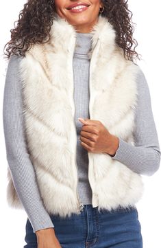 Soft and fluffy faux fur lends cozy comfort to a reversible vest equipped with handy pockets. Stand collar Lined 70% modacrylic, 30% acrylic faux fur with 100% polyester reverse Machine wash, line dry Imported Mink Vest, Fabulous Furs, Fall Fashions, Reversible Vest, Winter Capsule, Chevron Quilt, Faux Fur Vests, Innovative Fashion, Outerwear Vest