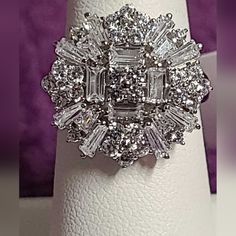 a white ring with many diamonds on it