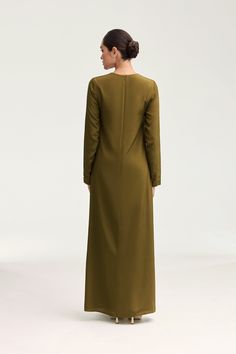 Indulge in luxury with the Estee Viscose Maxi Dress in Olive Night. Crafted with breezy viscose material, this dress boasts a modest fit and straight sleeves perfect for the summer. Dress it up or down and enjoy the ultimate comfort and effortless style no matter the occasion. Elevate your wardrobe with this exquisite piece. Model is 5'7" and is wearing size XS/58". White Dress Formal, Dresses Flowy, Nikkah Dress, Modest Fits, Engagement Dresses, Kids Outerwear, Basic Dress, Ribbed Dresses, Flowy Dress