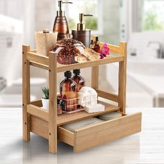 three tiered wooden shelf with soap and lotion