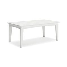 a white table on a white background with no one around it and the top is empty