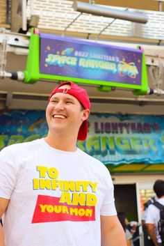 a man wearing a red hat standing in front of a store