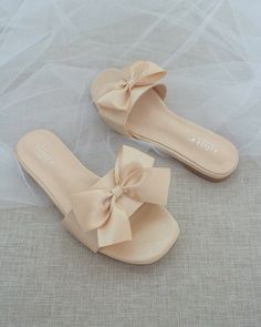 Classic slide flat sandals for casual and dressy look with added SATIN BOW. Simple and easy wear for brides, bridesmaids and wedding parties.DETAILS:UPPER: Synthetic upper and liningMATERIALS: Manmade outsoleHEEL HEIGHT: 0.4"Imported Materials Bridesmaid Sandals, Off White Shop, Flower Girl Shoes, Bridal Flats, Wedding Shoes Bride, Something Blue Wedding, Satin Shoes, Bridal Sandals, Wedding Guest Shoes