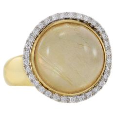 Indulge in luxury with our expertly crafted 18KT yellow gold sliding ring, featuring a cabochon rutilated quartz and diamonds totaling 0.38ct-tw in G-VS/SI round cuts. This timeless piece adds a touch of uniqueness with the stunning natural inclusions of the rutilated quartz, making it a luxurious addition to any jewelry collection. Enjoy the sophistication and elegance that comes with this exquisite combination of gold, diamonds, and the captivating beauty of rutilated quartz. Size 6.75 US. Wei Gold Slides, Rutilated Quartz, Timeless Pieces, Fashion Rings, Diamond Ring, Jewelry Collection, Jewelry Rings, Yellow Gold, Size 6