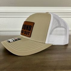 F Around And Find Out Patch Hat Khaki Specifications: 🧢 Richardson original 112 trucker; adjustable for the perfect fit 🎩 60/40 cotton/polyester blend for comfort 📏 One size fits most 🏷️ Expertly laser engraved leatherette patch design 📦 Ships in 2 to 3 business days from our Orlando Studio Care Instructions: 🚫 Do not wash; spot clean only Please Note: 🌈 Colors may vary from photos based on your viewing screen. This funny hat is a unique and entertaining gift for fathers, embracing their White Adjustable Leather Hat, Adjustable White Leather Hat, White Snapback Hat With Leather Patch, White Snapback Trucker Hat With Leather Patch, White Trucker Hat With Leather Patch, Adjustable White Trucker Hat With Leather Patch, Orlando Studios, Entertaining Gifts, Funny Hats