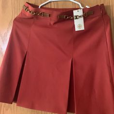 Tory Burch Skirt Redwood Pleated Skirt In Excellent Condition. Still Has Tags. Small Blemish On Front. Size 2 Chic Red Mini Skirt For Formal Occasions, Chic Red Formal Mini Skirt, Red Flowy Skirt For Formal Occasions, Red Formal Flowy Skirt, Formal Red Flowy Skirt, Red Flared Pleated Skirt For Work, Red Flowy Formal Skirt, Red Office Skirt For Spring, Red Office Skirt