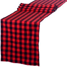 three red and black checkered table runners on top of each other with one folded